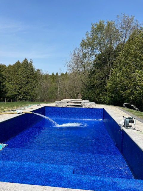 Pool being filled with water.